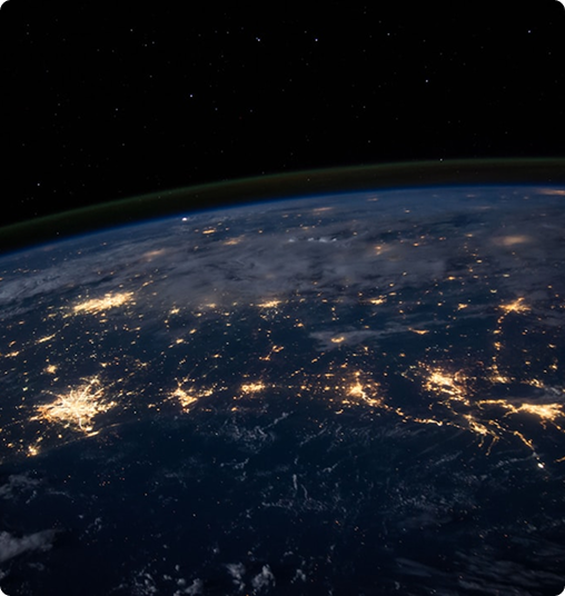 Earth at night time with glowing lights symbolising connectivity