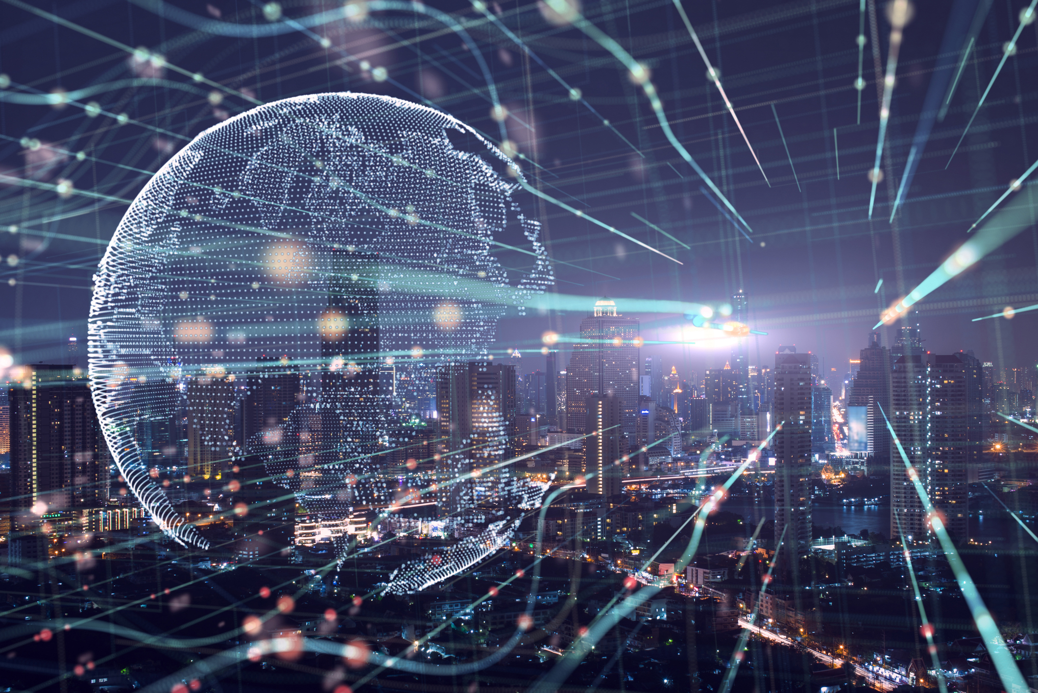 City scape at night with overlay of lines and an outline of a globe made out of small dots.