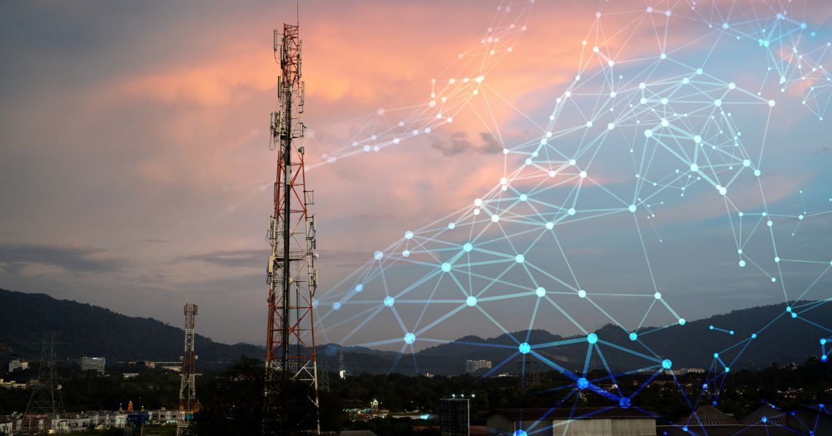 sunset cloudy sky with a mobile tower in front and light up lines connecting dots